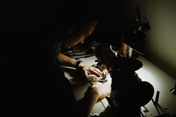 Artist sewing at an industrial machine in their ArtLab studio